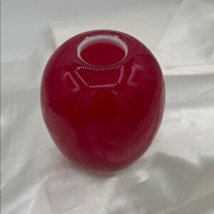 A vintage red cased glass vase, features a "cased glass" or Royal Ruby Design.